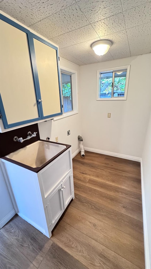 bathroom featuring hardwood / wood-style flooring, a paneled ceiling, plenty of natural light, and vanity