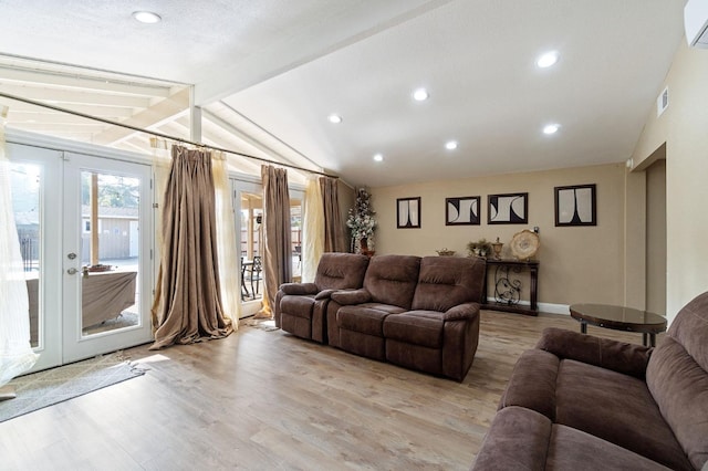 5870 E Midwick Ln, Fresno, CA 93727 - living area featuring light wood-style flooring, french doors, a wall unit AC, recessed lighting, and baseboards