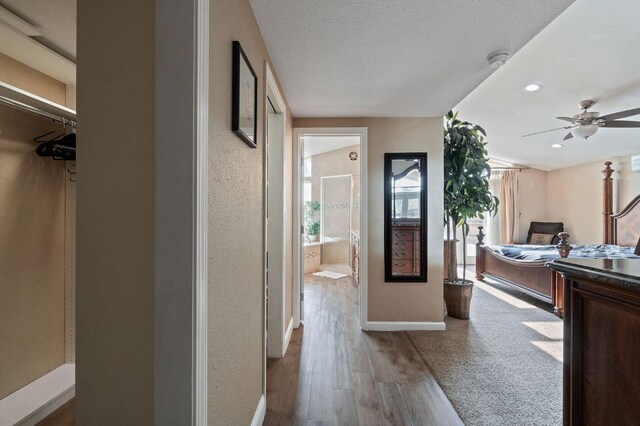 5870 E Midwick Ln, Fresno, CA 93727 - hall with baseboards, wood finished floors, and recessed lighting