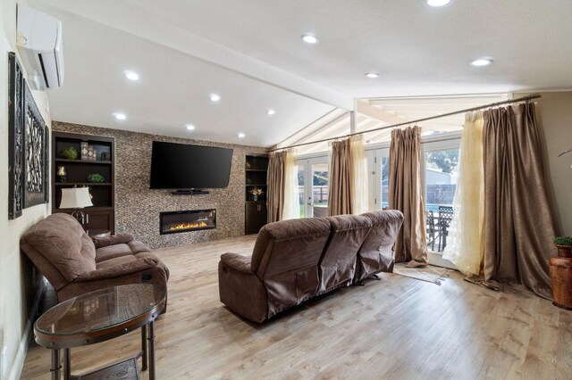 5870 E Midwick Ln, Fresno, CA 93727 - living area with a wall mounted air conditioner, light wood-style floors, a large fireplace, recessed lighting, and built in shelves