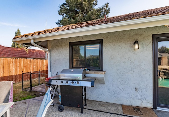 view of patio featuring a grill