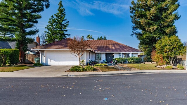 ranch-style home with a garage