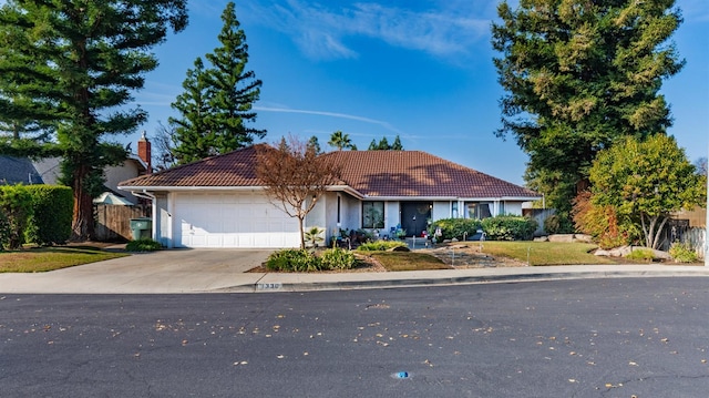 ranch-style house featuring a garage