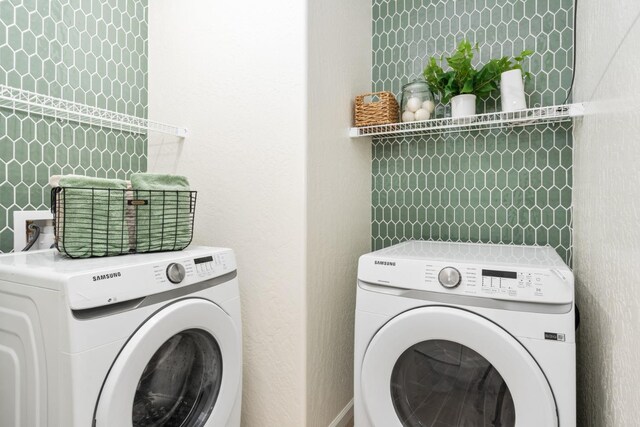 washroom with separate washer and dryer