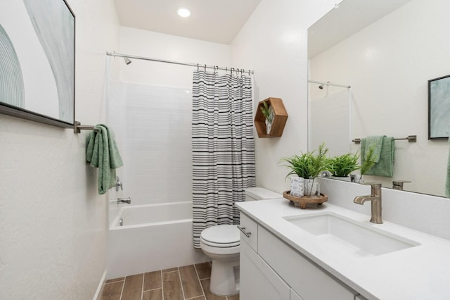 bathroom featuring vanity, toilet, shower / bathtub combination with curtain, and wood tiled floor