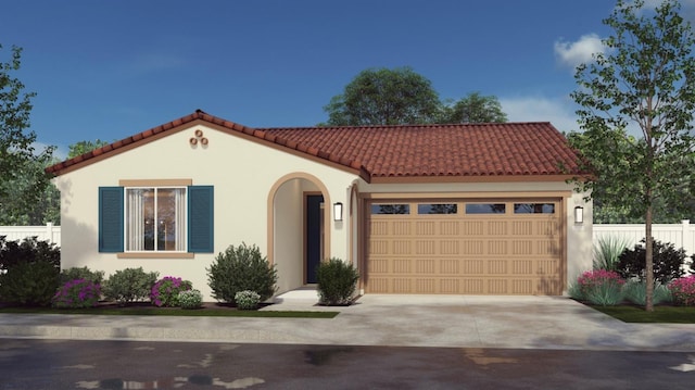 mediterranean / spanish-style house with a garage