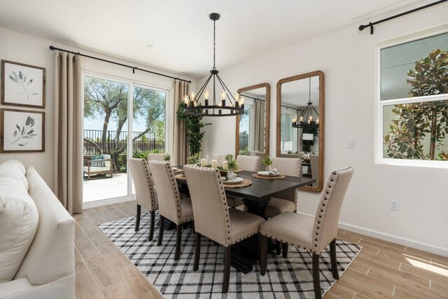 dining area with an inviting chandelier