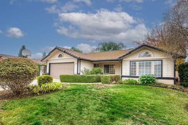 single story home with a front yard and a garage