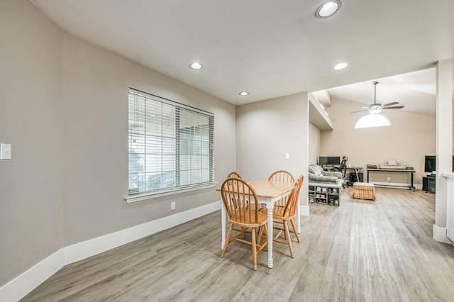 dining area with ceiling fan and light wood-type flooring