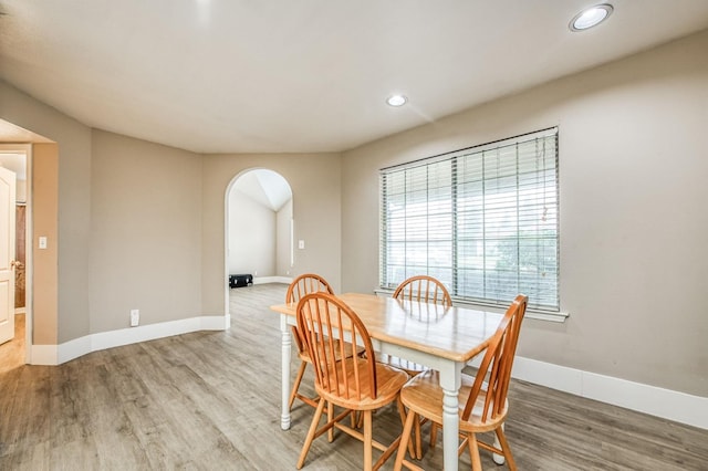 dining space featuring wood-type flooring