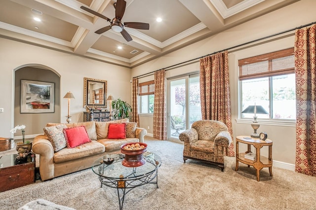 living room featuring ceiling fan, light colored carpet, ornamental molding, and coffered ceiling