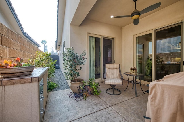 view of patio featuring ceiling fan