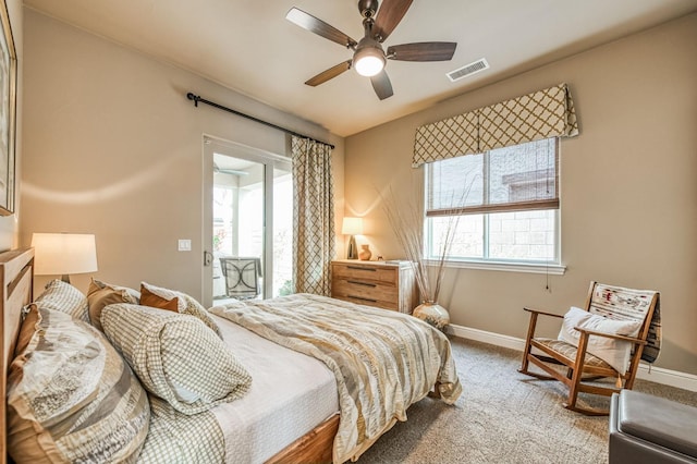 bedroom featuring carpet flooring, ceiling fan, and multiple windows