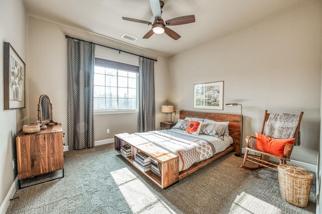 bedroom with ceiling fan and carpet floors