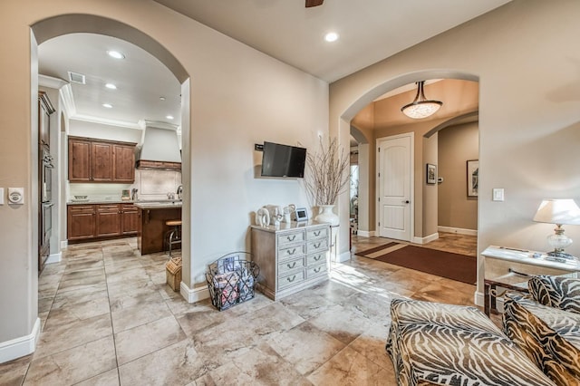 hall featuring ornamental molding