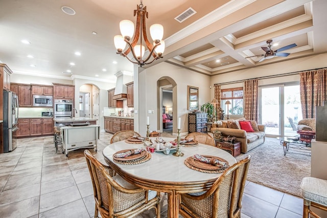 tiled dining space with beam ceiling, ceiling fan with notable chandelier, coffered ceiling, and ornamental molding