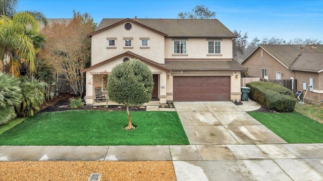 view of property with a garage and a front yard