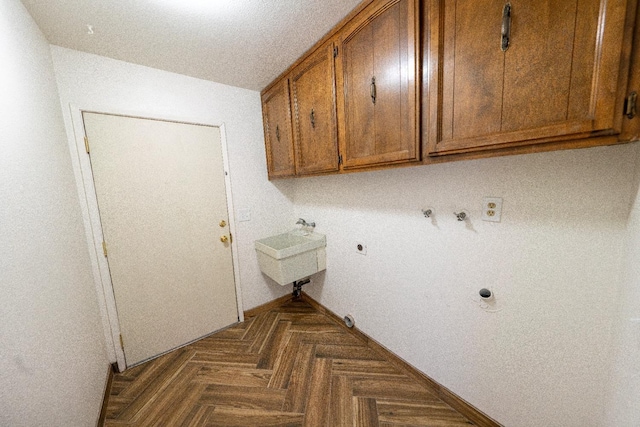 laundry room featuring sink, cabinets, hookup for an electric dryer, hookup for a gas dryer, and dark parquet floors