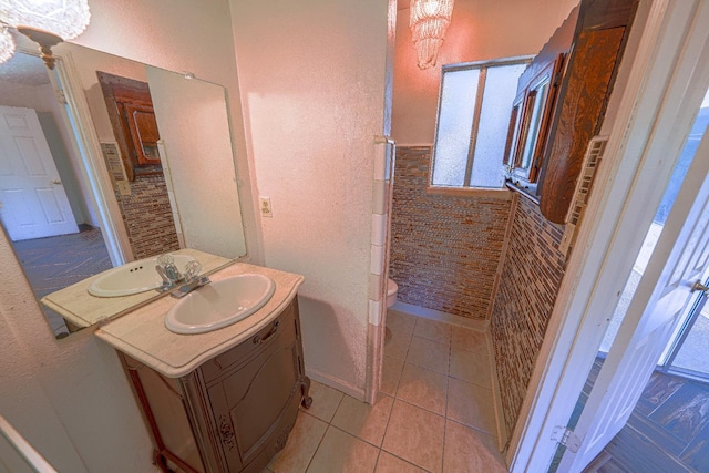 bathroom with tile patterned floors, vanity, and toilet