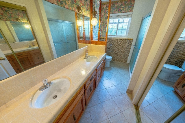 bathroom featuring tile patterned flooring, vanity, and toilet