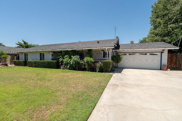 ranch-style house with a garage and a front lawn