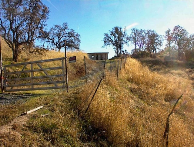 view of gate featuring a rural view