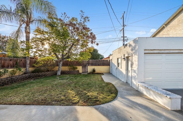 view of yard featuring a garage