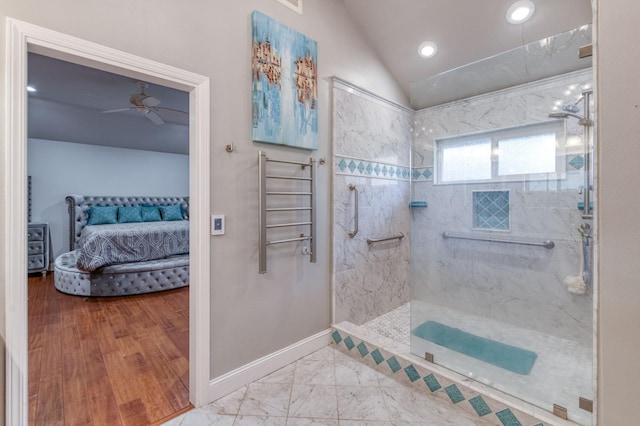 bathroom featuring tiled shower, wood-type flooring, vaulted ceiling, and ceiling fan