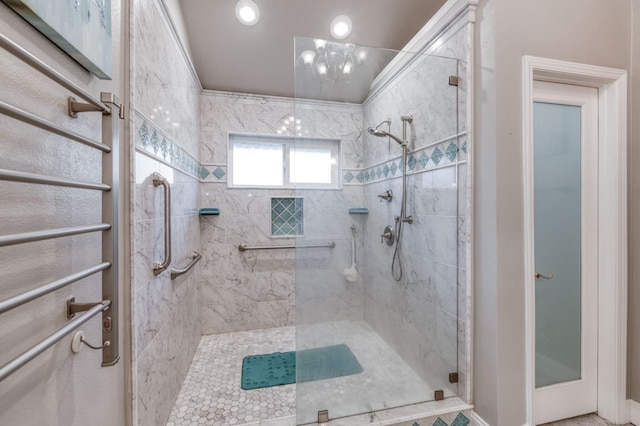 bathroom featuring a shower with shower door and an inviting chandelier