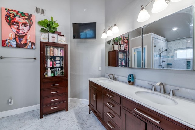 bathroom featuring vanity and a tile shower