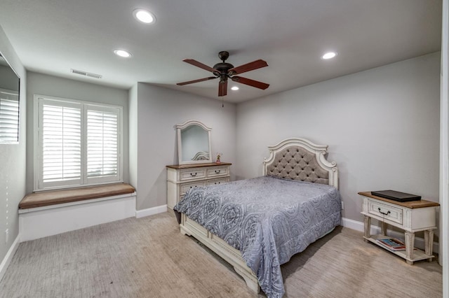 bedroom featuring ceiling fan and light colored carpet