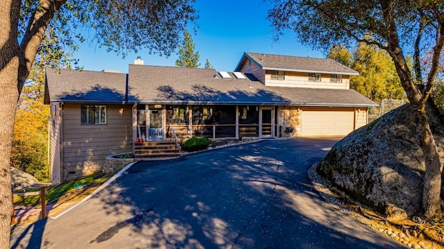 view of front of house with a sunroom