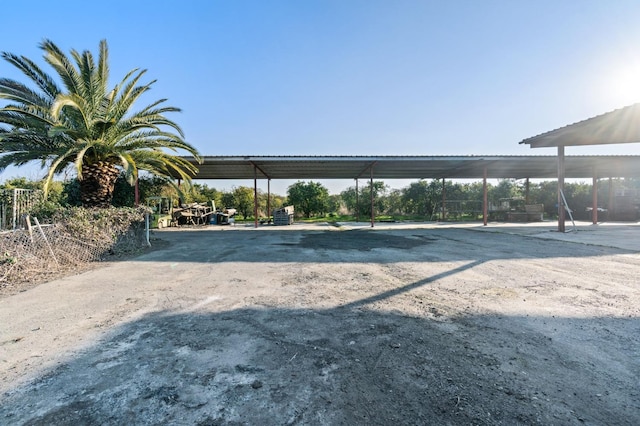 view of vehicle parking featuring a carport