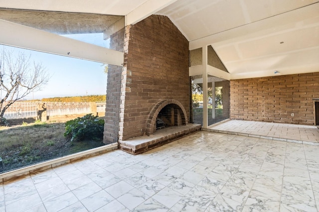 view of patio / terrace featuring an outdoor brick fireplace