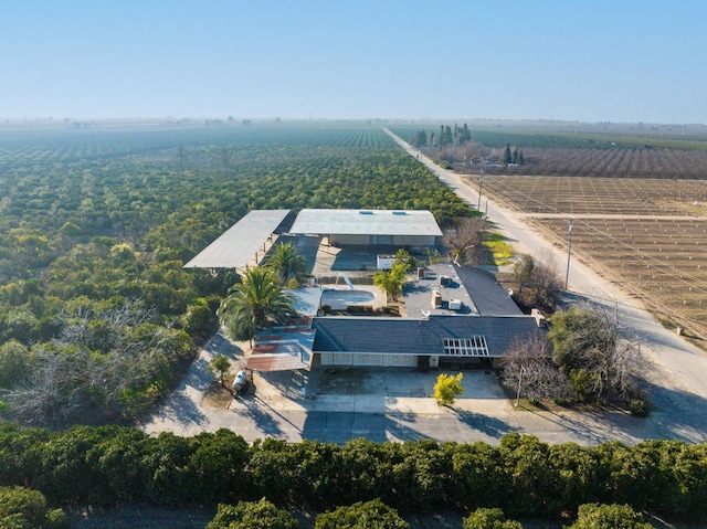 birds eye view of property with a rural view