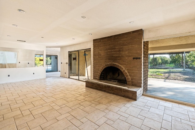 unfurnished living room with a fireplace