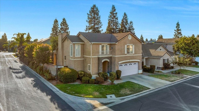 view of front of home featuring a balcony and a garage