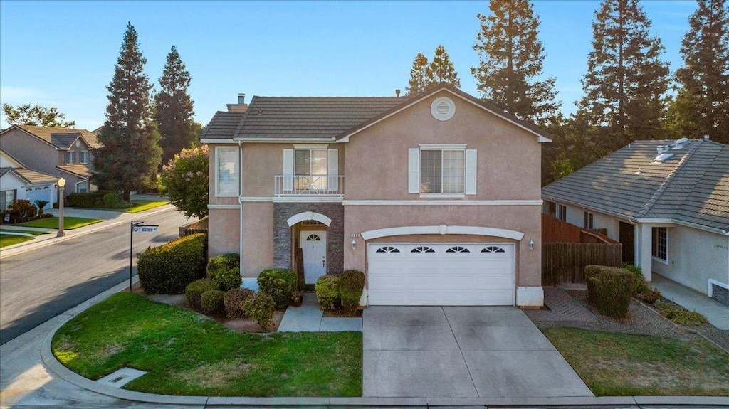 view of front property with a balcony and a garage