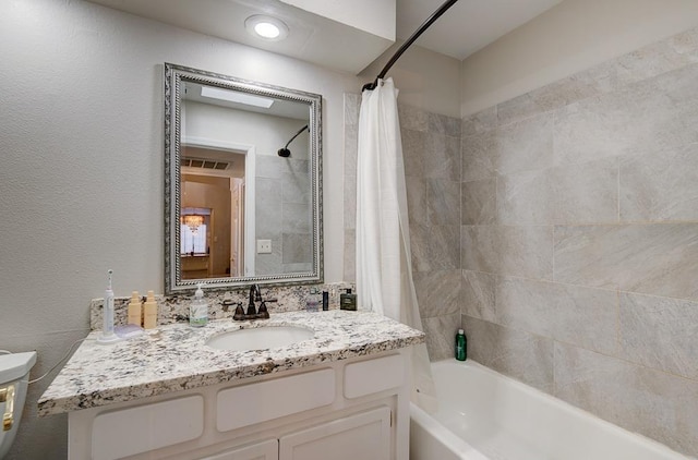 bathroom with vanity and shower / bathtub combination with curtain