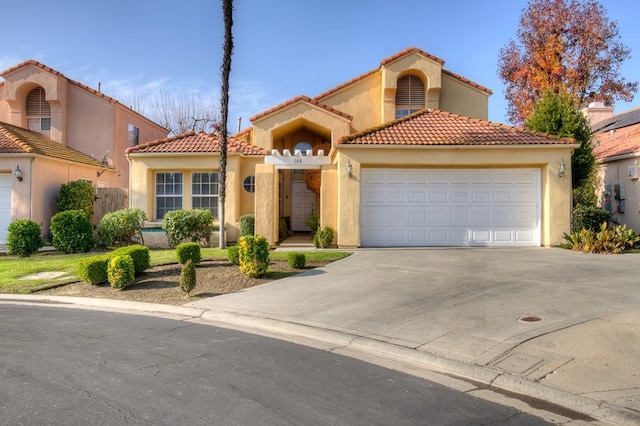 mediterranean / spanish house featuring a garage