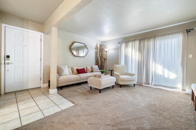 living room with light colored carpet and a textured ceiling