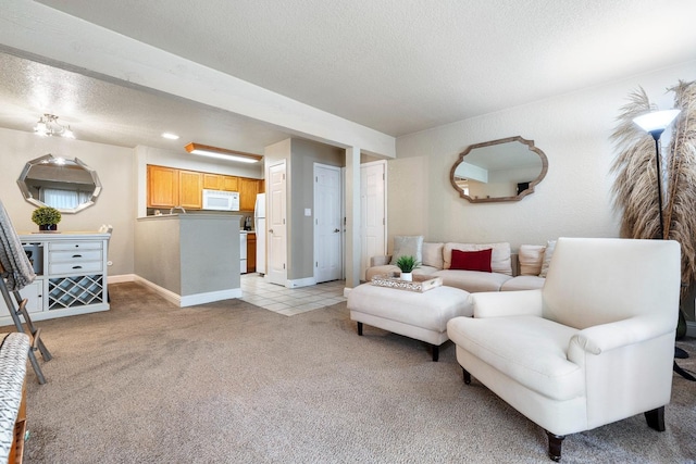 living room featuring light carpet and a textured ceiling