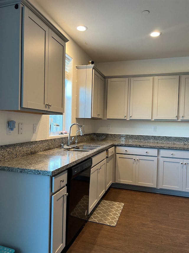 kitchen featuring dark hardwood / wood-style flooring, black dishwasher, gray cabinetry, and sink