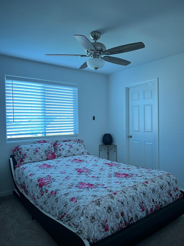 carpeted bedroom featuring ceiling fan