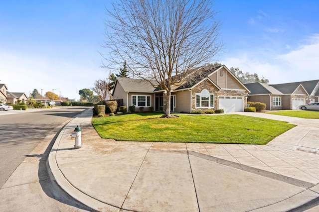 view of front of property with a garage and a front lawn