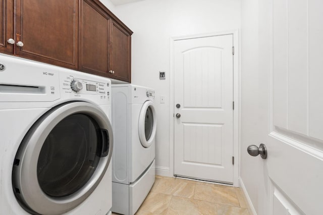 laundry area with cabinets and independent washer and dryer