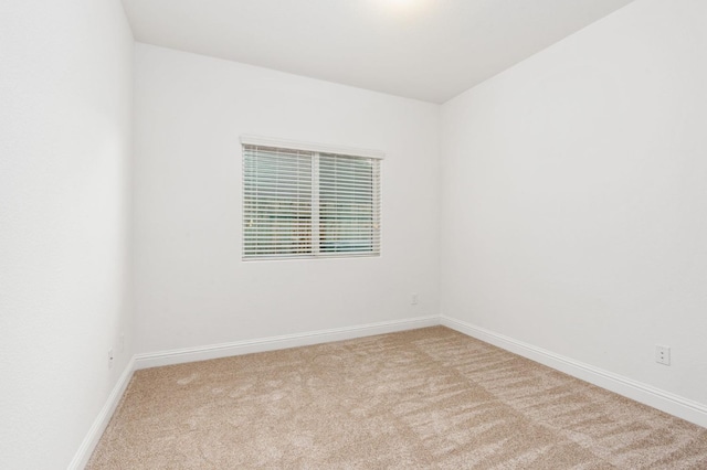 spare room with light carpet