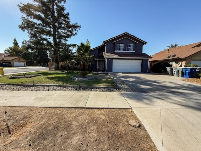 view of front property featuring a garage and a front lawn