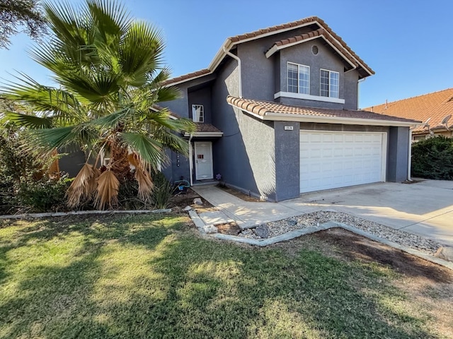 view of front facade featuring a garage and a front lawn