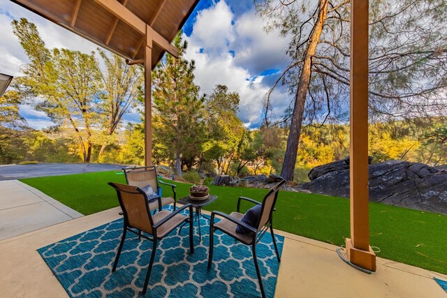 50365 Spook Ln, Oakhurst, CA 93644 - view of patio / terrace featuring an outdoor fire pit